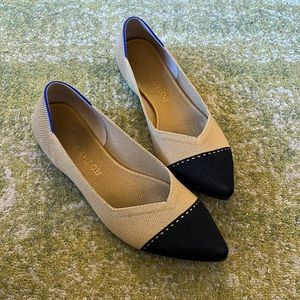 Rothy’s nude flat w/ black cap toe